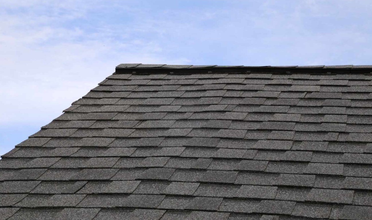 Storm damaged asphalt shingle roof requiring emergency repair in Coachella, CA